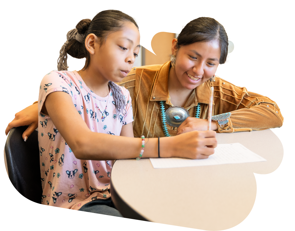 Teacher helping student with her work