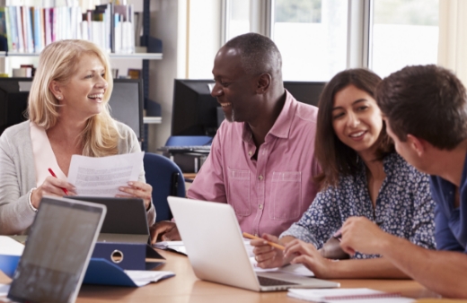 A group of teachers working in a lounge