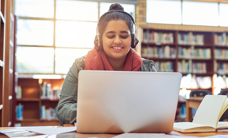 A high school student on a laptop