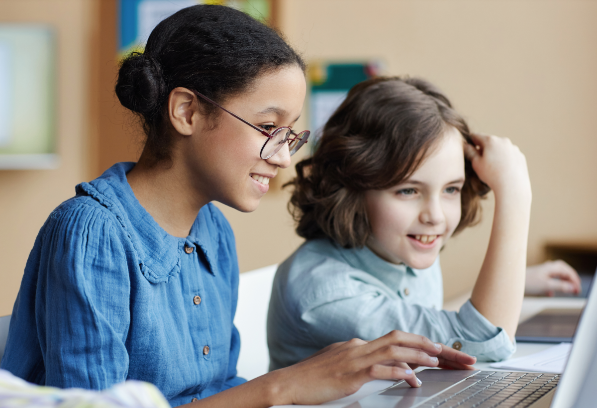 Two students working in school